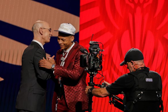 Jeremiah Fears greets NBA commissioner Adam Silver after being selected seventh by the New Orleans Pelicans.