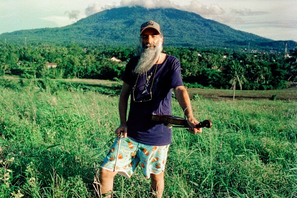 Ellis with his violin at Ellis Park in Sumatra.