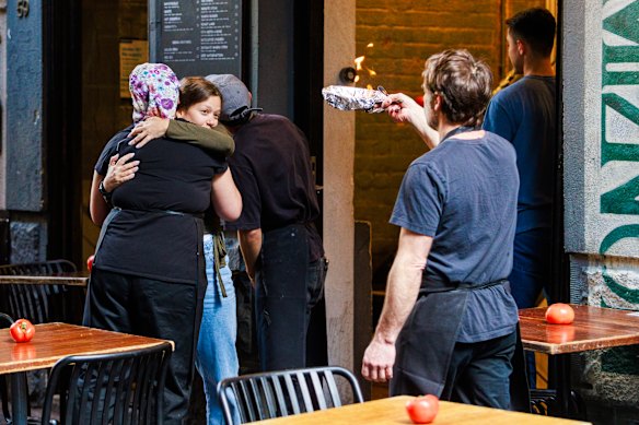 A Miznon staff member conducts a prayer ritual before the restaurant opened on Saturday.