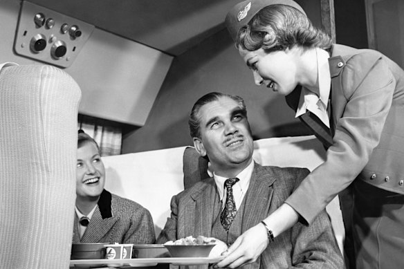 A Capital Airlines flight attendant at work in the 1950s.