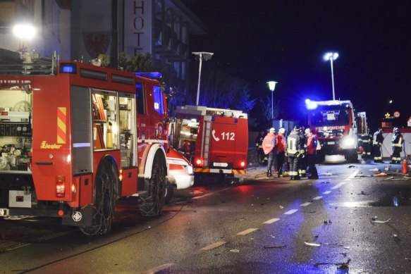 The voluntary fire brigade secure an accident site after a car drove into a group of people in Lutago, Italy on Sunday morning.