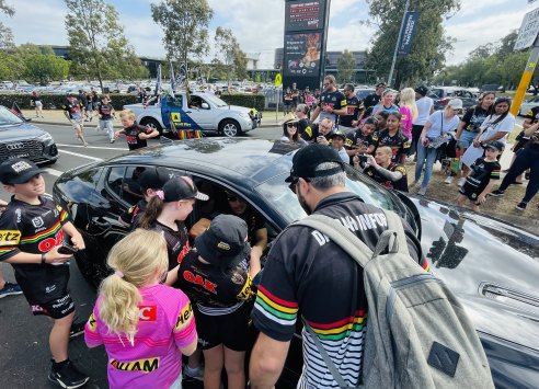 Jarome Luai stops traffic in Penrith on Monday morning.