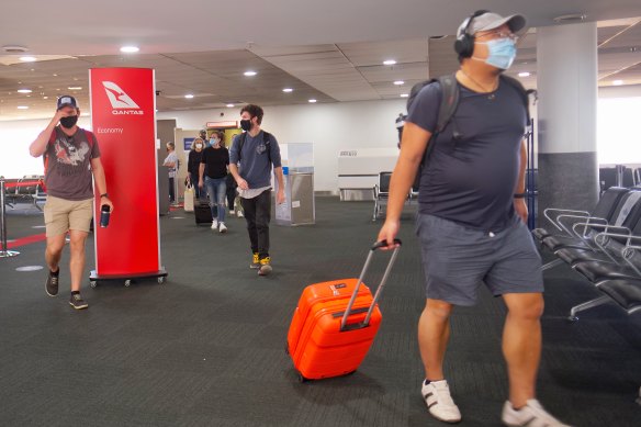 Passengers arriving at Melbourne Airport from Brisbane this afternoon.