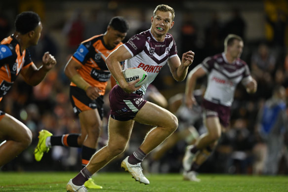 Tom Trbojevic on his way to the try line on Thursday night against the Tigers.