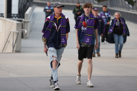 Melbourne Storm fans walk into the stadium.