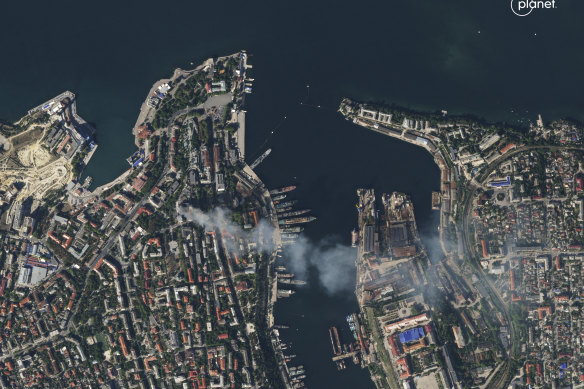A satellite photo shows smoke billowing from a headquarters building for the Russian Black Sea fleet in Sevastopol, Crimea on Friday.