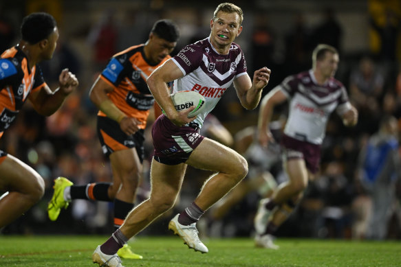 Tom Trbojevic on his way to the try line on Thursday night against the Tigers.