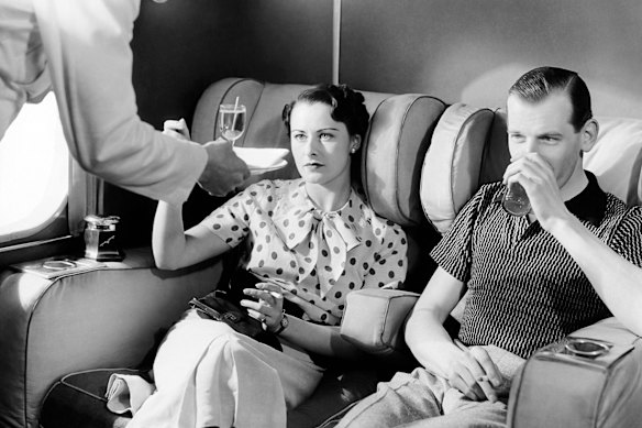 Cocktails in the smoking lounge, the only way to fly – back in the 1930s aboard an Imperial Airways Empire boat passenger plane.