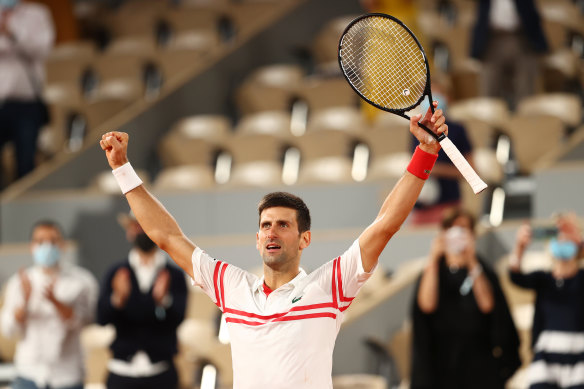 Novak Djokovic celebrates after winning match point during his Men’s Singles Semi Final match against Rafael Nadal.