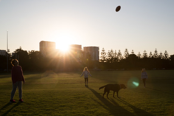 Penelope Bell with her two children, Inti and Ajla, play at Tempe Reserve.