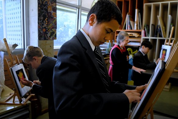 Year 7 Trinity Grammar School students Max France, Kobe Manu and Kai Pham in art class. 