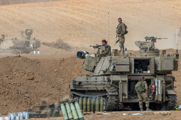 Israeli soldiers prepare their vehicles in the city of Netivot amid retaliations in the Gaza Strip.
