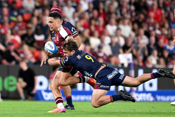 Kalani Thomas on the rampage for the Reds against the Highlanders at Suncorp Stadium.