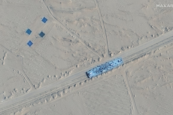 A satellite image shows what appears to be a mock-up of a US Navy vessel in Ruoqiang county, China.