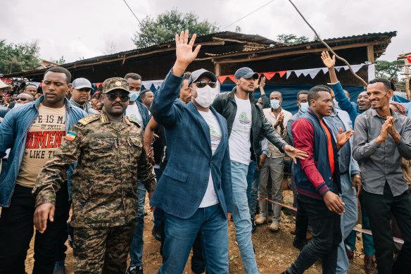 Ethiopian Prime Minister Abiy Ahmed walks to a polling location to cast his vote in the country’s national election at his home town of Beshasha.