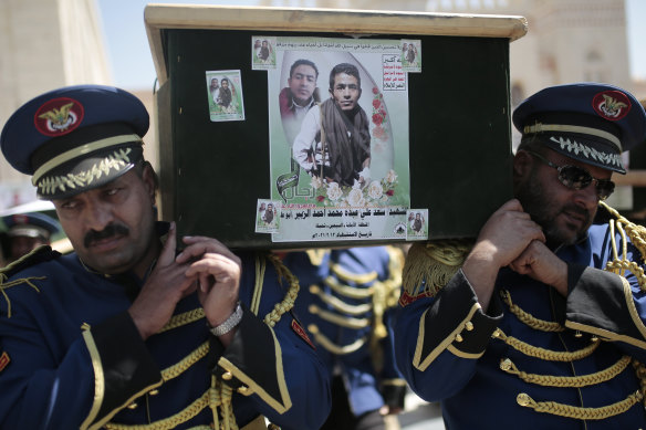 Honor guards carry coffins adorned with photographs of Houthi rebel fighters who who were killed in recent fighting with forces of Yemen’s Saudi-backed internationally recognised government during their funeral procession, in Sanaa last month.
