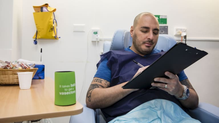 Alex Giraldo, 37, sits in the recovery room after getting a vasectomy at Marie Stopes in Westmead in Sydney. 