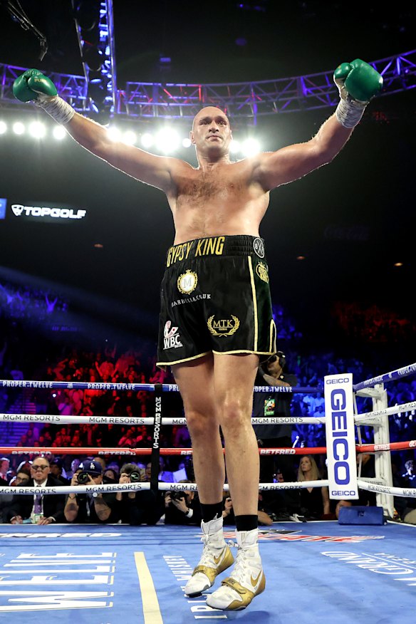 Tyson Fury celebrates after knocking down Deontay Wilder in Las Vegas.