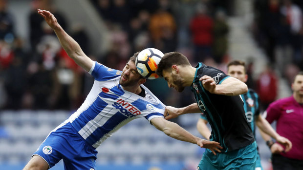 Wigan Athletic's Will Grigg and Southampton's Wesley Hoedt go head-to-head in their FA Cup quarterfinal.