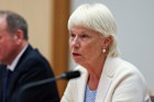 Singtel board director Gail Kelly and fellow board member John Arthur, who also serves as Optus chairman, give evidence to the Senate inquiry on Thursday.