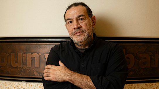 Artist Khaled Sabsabi, who had his invitation to participate in the Venice Biennale revoked by Creative Australia, with his work at Barangaroo Metro Station in Sydney.