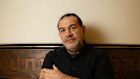 Artist Khaled Sabsabi, who had his invitation to participate in the Venice Biennale revoked by Creative Australia, with his work at Barangaroo Metro Station in Sydney.