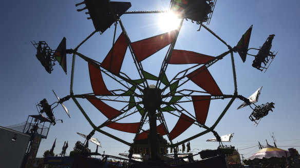Fairgoers take a turn on the Cliff Hanger,  at the Berrien County Youth Fair in Berrien Springs, Mich,