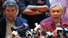 United Malays National Organisation President Ahmad Zahid Hamidi, right, addresses the media on Monday.