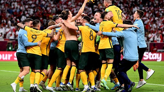 The Socceroos celebrate their penalty shootout win over Peru.