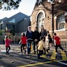 St Kilda Primary School grandparent Jenny Brew, and parents Caroline Thornton and Selina Ife and their children and grandchildren outside St Kilda Primary School.