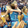 Lauren Jackson celebrates with teammates after the Southside Flyers clinched victory on Sunday.