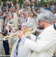 The Richies organiser Michael Hennessy with trumpet players Dan Johnson and David Mahon lead The Richies in performing their rendition of 'Kookaburra sits in the Old Gum Tree' .