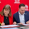 Griffith University vice chancellor Carolyn Evans and Logan Mayor Jon Raven sign a MOI to build a baseball and softball stadium at the university’s Logan campus.