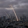 Israel’s Iron Dome air defence system fires to intercept projectiles over Tel Aviv on Saturday. Iran struck back after Israel launched its surprise attack a day earlier.