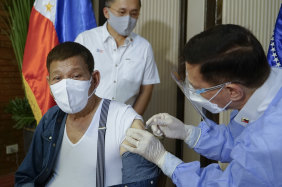 Philippine President Rodrigo Duterte receives his second dose of Sinopharm in July.
