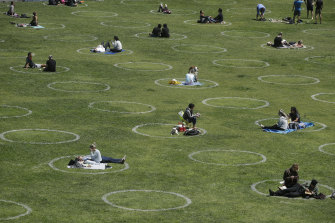 People picnicking inside physical distancing circles at Dolores Park in San Francisco in June.