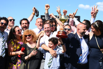 Connections celebrate Verry Elleegant’s win in the Melbourne Cup.