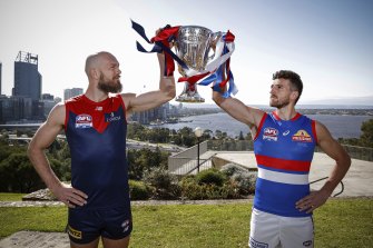 Melbourne captain Max Gawn and Bulldogs skipper Marcus Bontempelli with the AFL Premiership Cup at Kings Park.