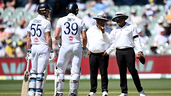 Reviewing the review: England’s Ben Stokes and Jamie Smith speak to umpires Ahsan Raza and Nitin Menon.