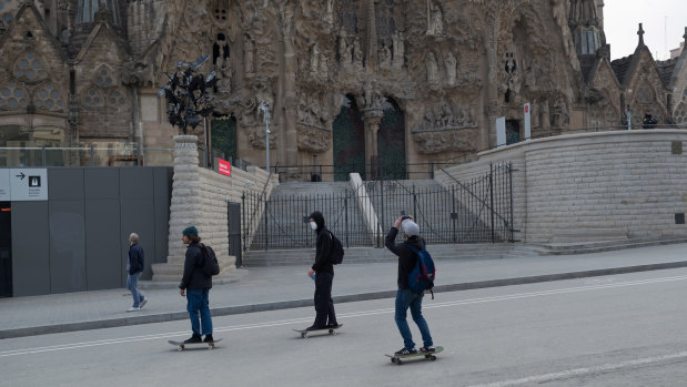 Skaters ride on the first day of the coronavirus pandemic lockdown in Barcelona in March 2020.