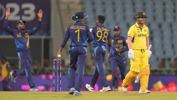 Australia’s David Warner leaves the ground after losing his wicket.