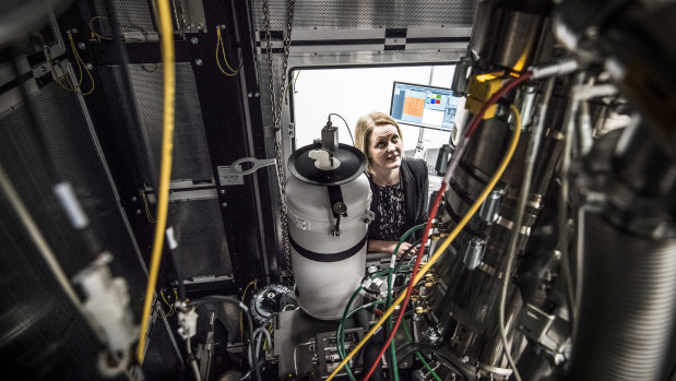 Professor Julie Cairney looking inside the new microscope, which costs about the same as a Sydney home.