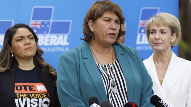 Kerrynne Liddle (centre) with Coalition senators Jacinta Price and Michaelia Cash.