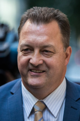 Former detective Paul Dale leaving the royal commission after testifying in May 2019