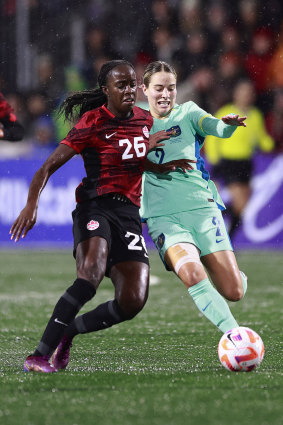 Simi Awujo and Courtney Nevin battle for the ball.