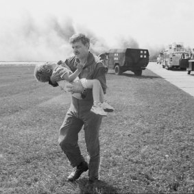 Spencer Bailey is carried after the 1989 crash-landing of United Flight 232 in Sioux City, Iowa.