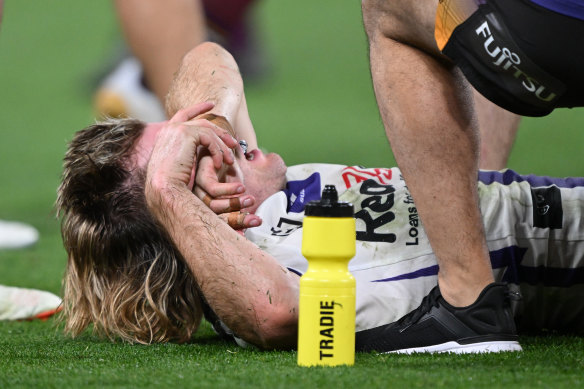 Ryan Papenhuyzen was grabbing his right ankle.