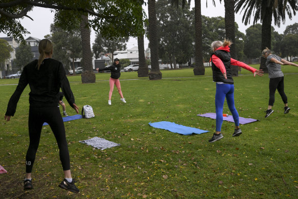 Personal trainer Keighly Collins of Sweat With Soul Fitness with her class in Port Melbourne on Wednesday.