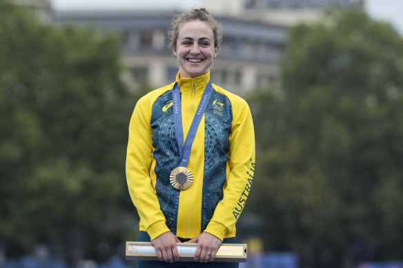 Grace Brown is all smiles after being presented with Australia’s first gold medal at the Paris Olympics.