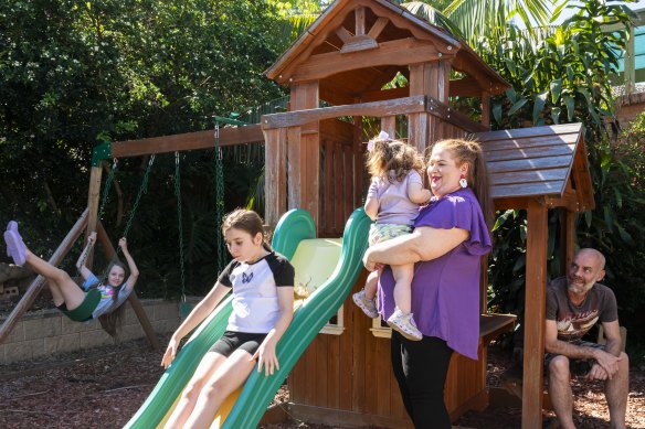 Michelle Walker at home in Baulkham Hills with daughters Valentina, Rochelle, and Charlize and husband Steve. 